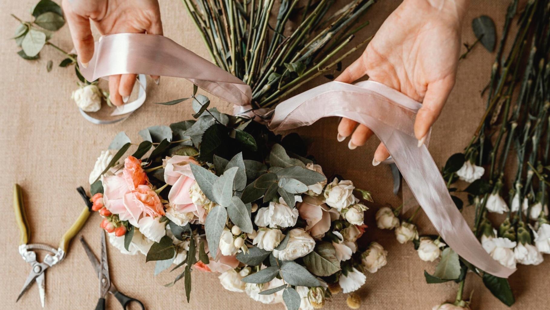 Professional wedding floristry demonstration showing expert techniques